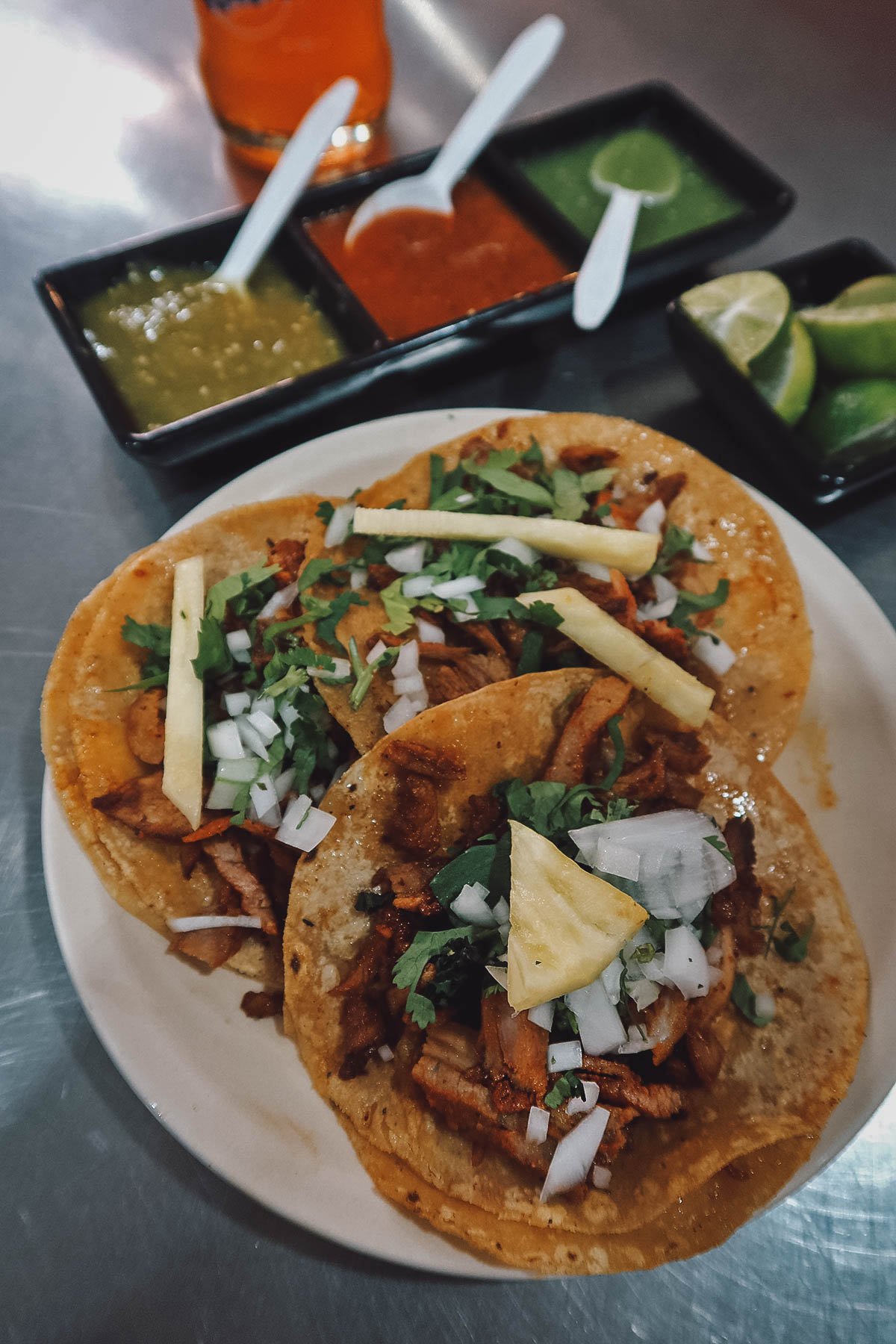 Plate with three tacos al pastor