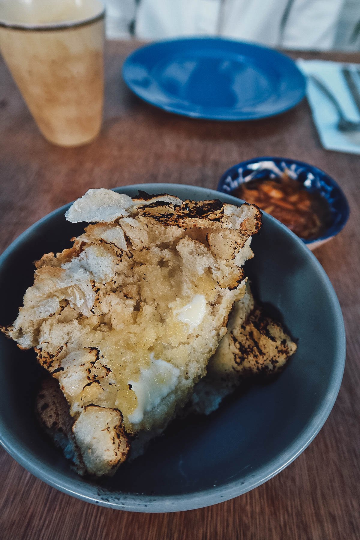 Home-baked bread with butter and guava jam