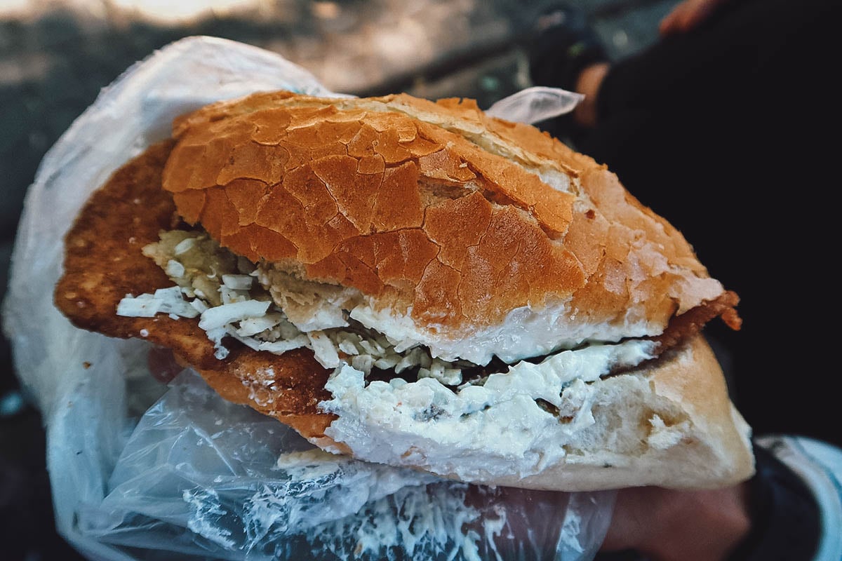 Torta de chilaquiles from a street food stand in Mexico City