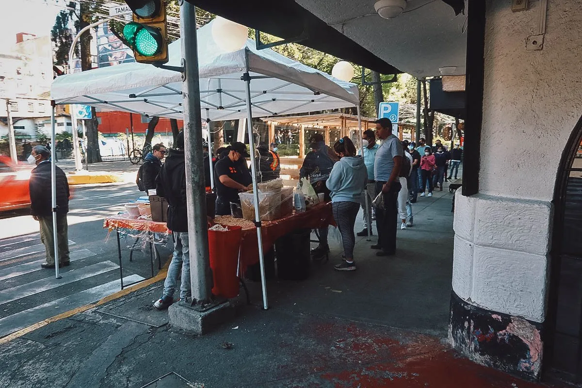 Line of customers at La Esquina del Chilaquil street food stall in Mexico City