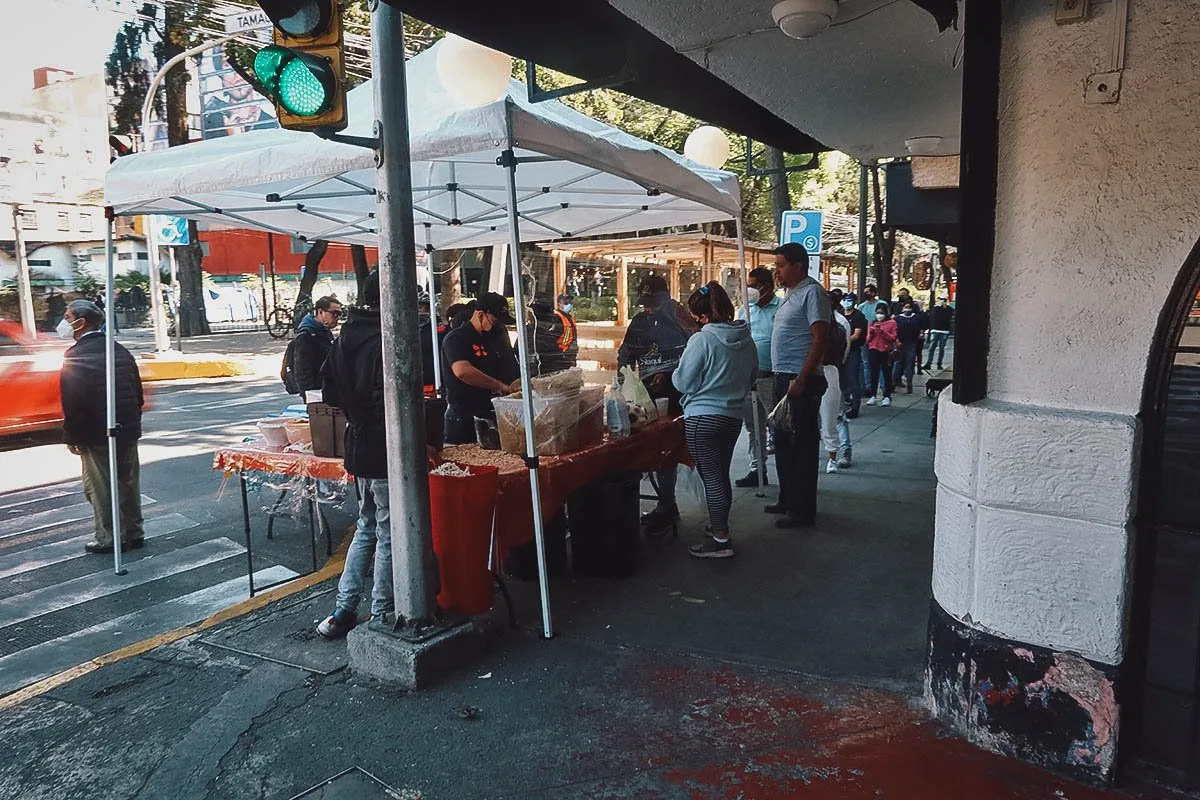 The Best Food in Mexico City Line of customers at La Esquina del Chilaquil street food stall in Mexico City
