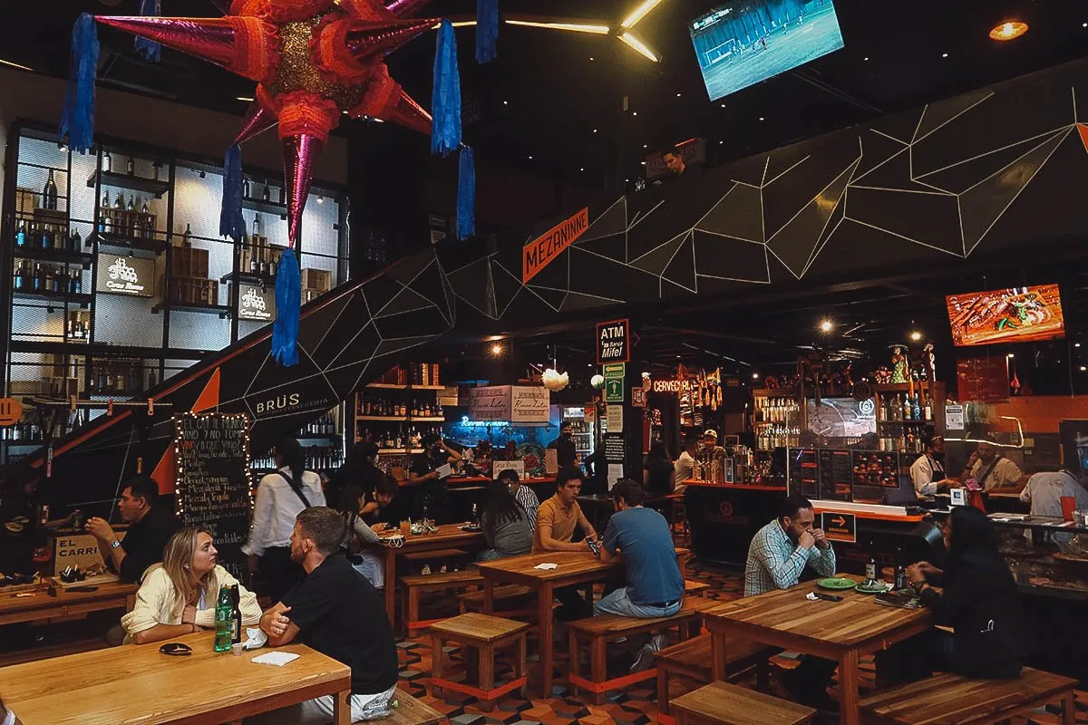 Dining area inside Mercado Roma food hall in Mexico City