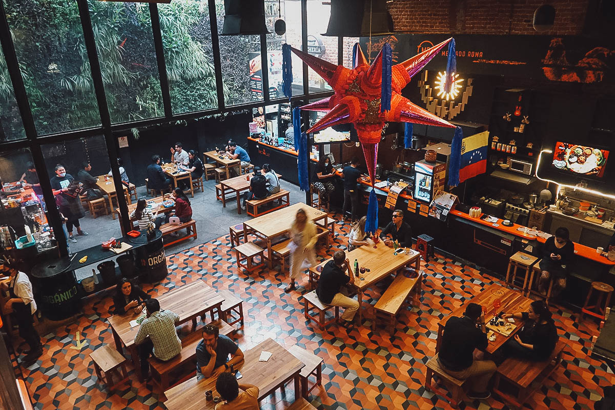 Dining area inside Mercado Roma food hall in Mexico City