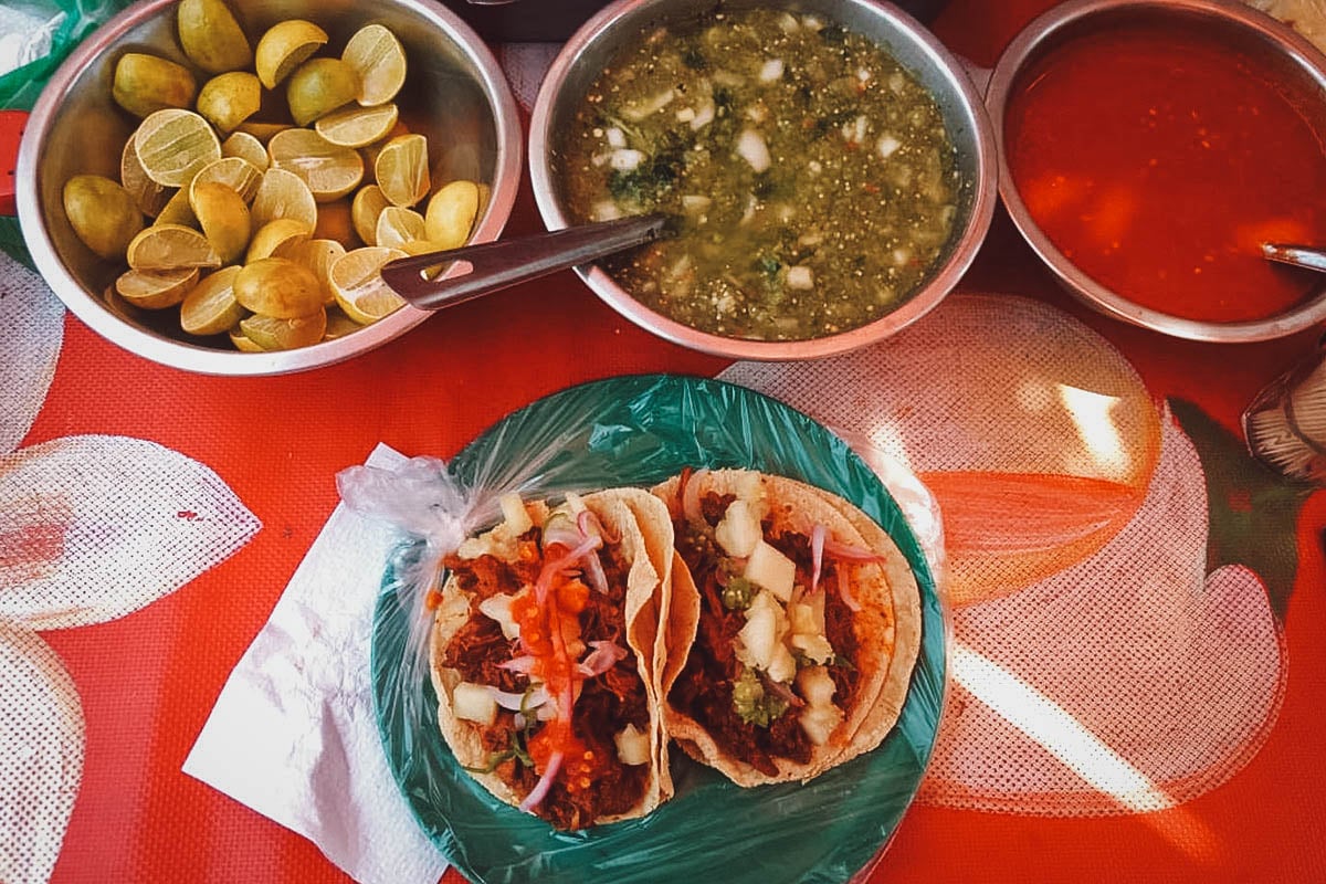 Tacos, salsas, and limes from a street food stall