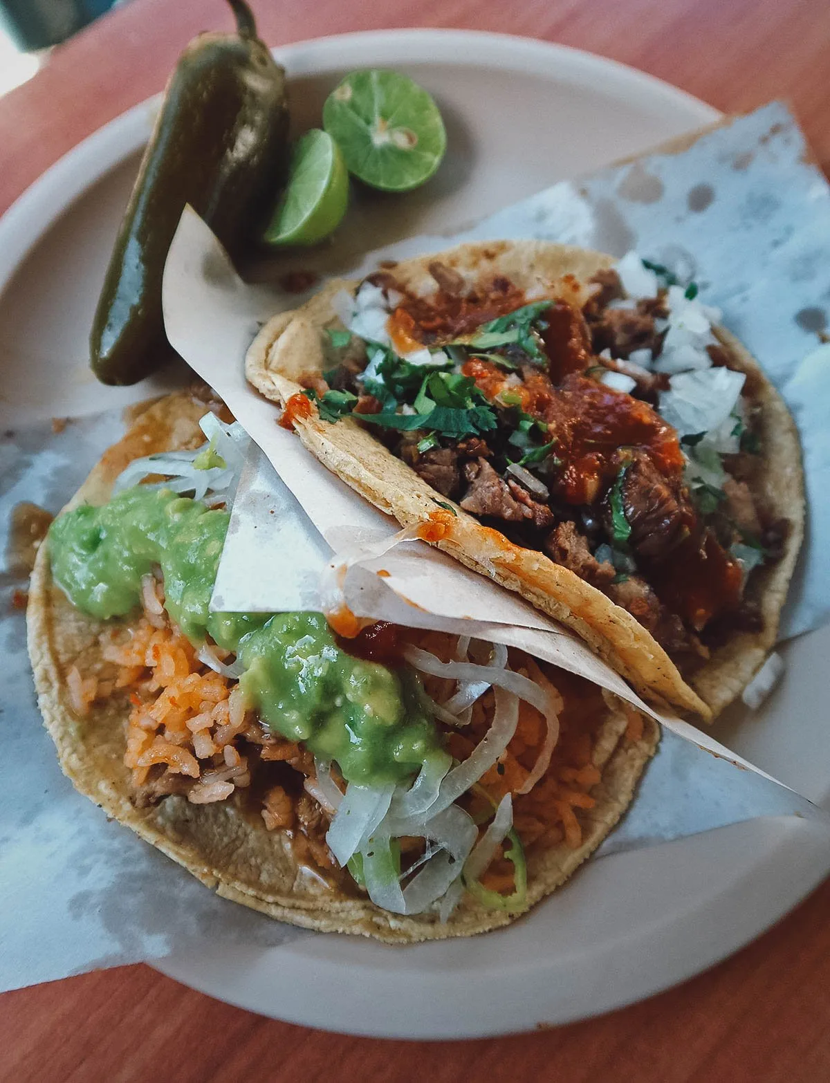 Taco de suadero and taco de lengua at a restaurant in Mexico City