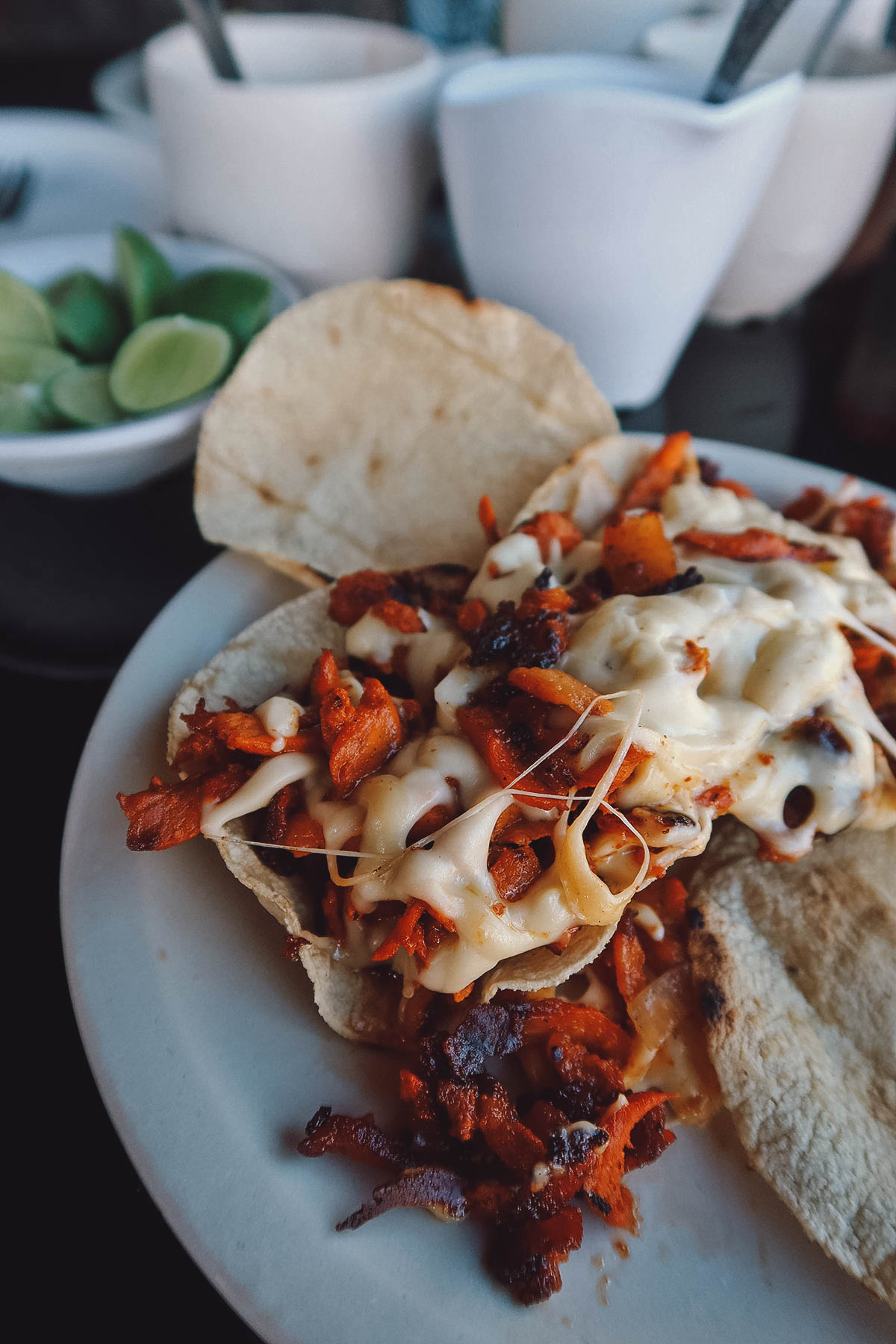 Volcanes topped with al pastor meat and cheese