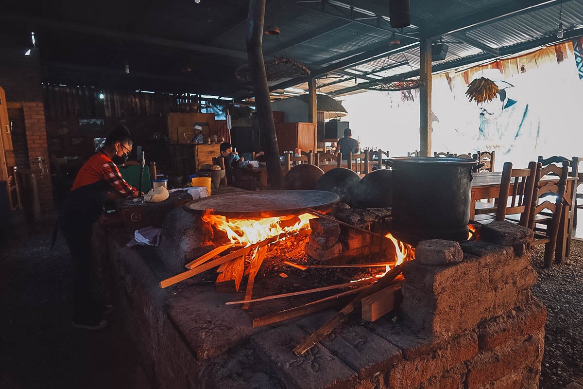 Burning wood fire at Caldo de Piedra restaurant in Oaxaca
