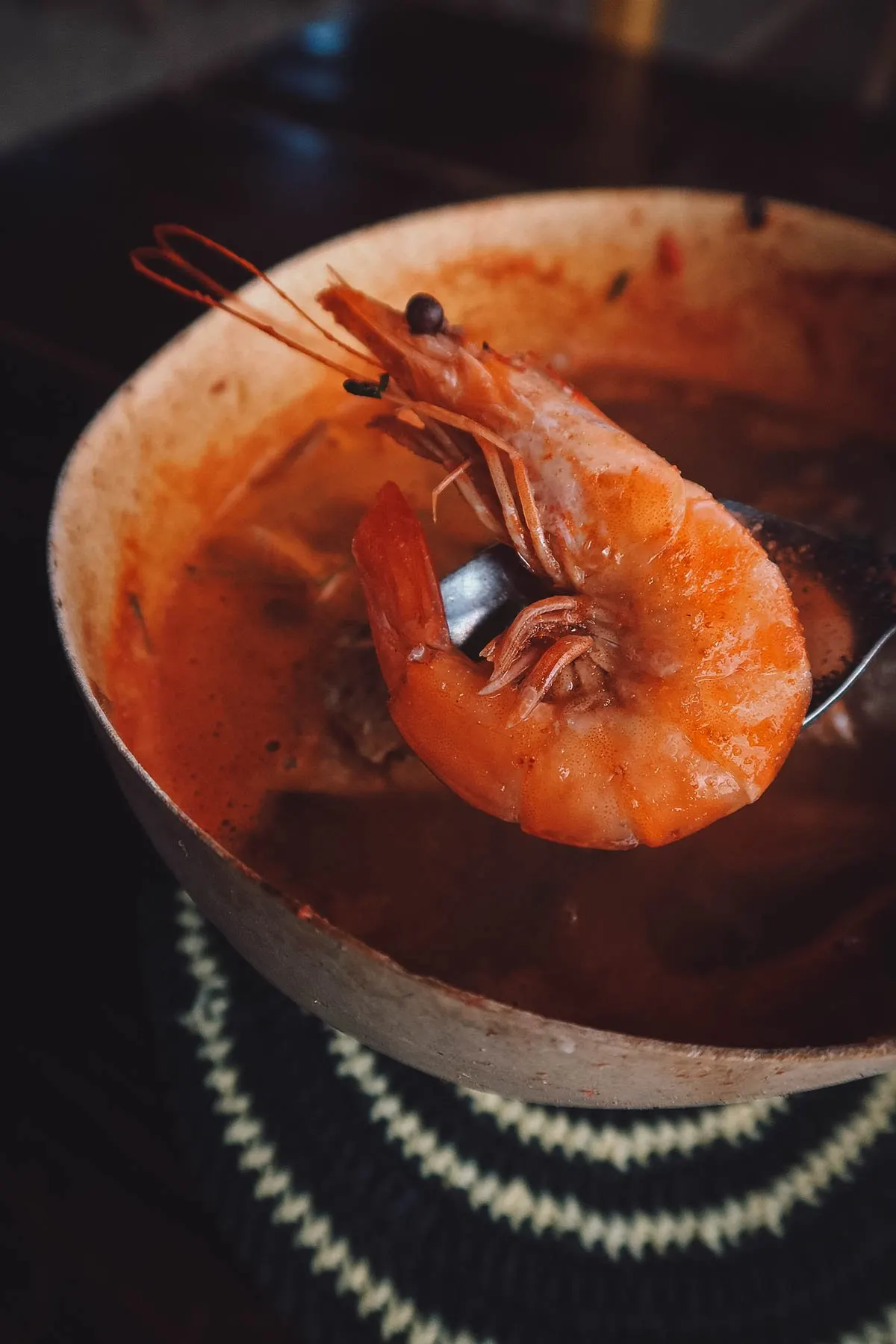 Piece of shrimp in caldo de piedra