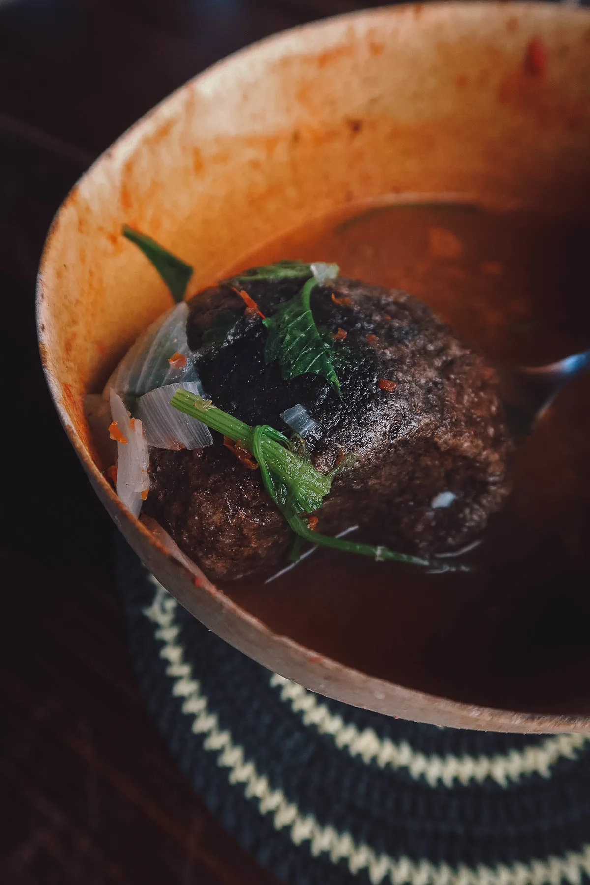 River stone inside a bowl of caldo de piedra