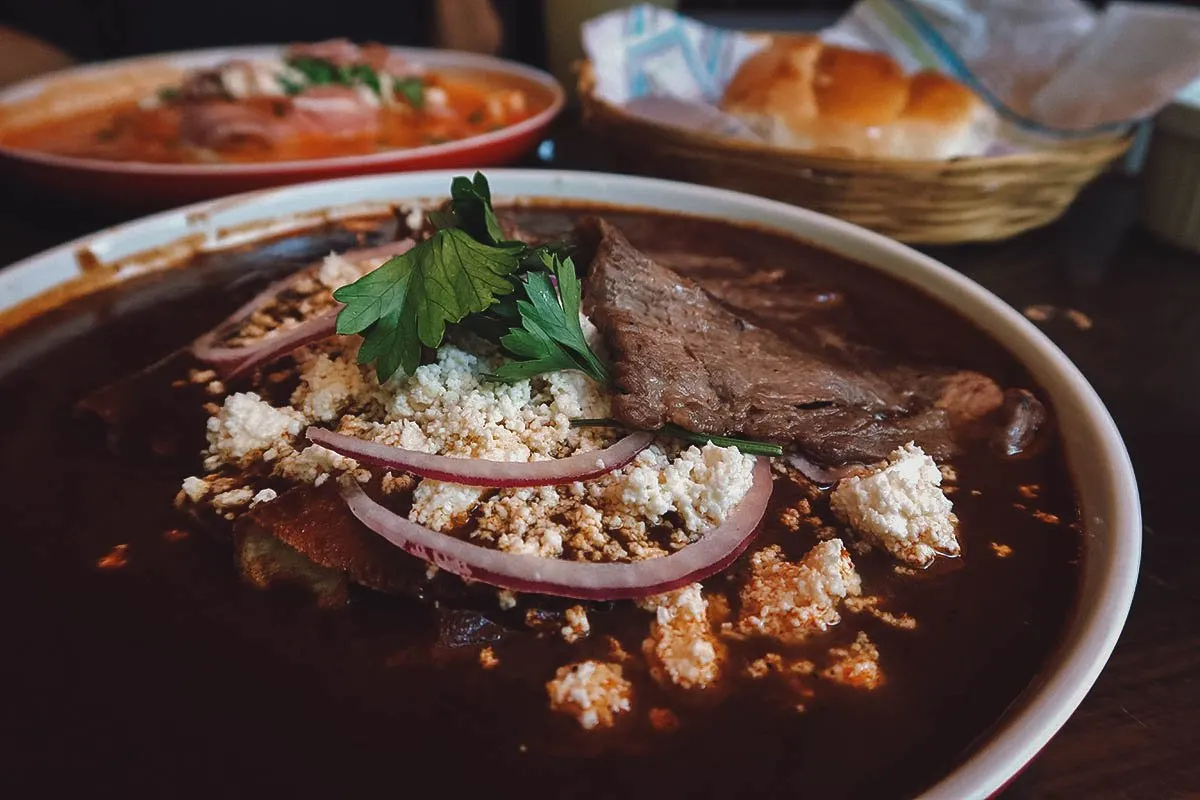 Enmolada with tasajo at a restaurant in Oaxaca City