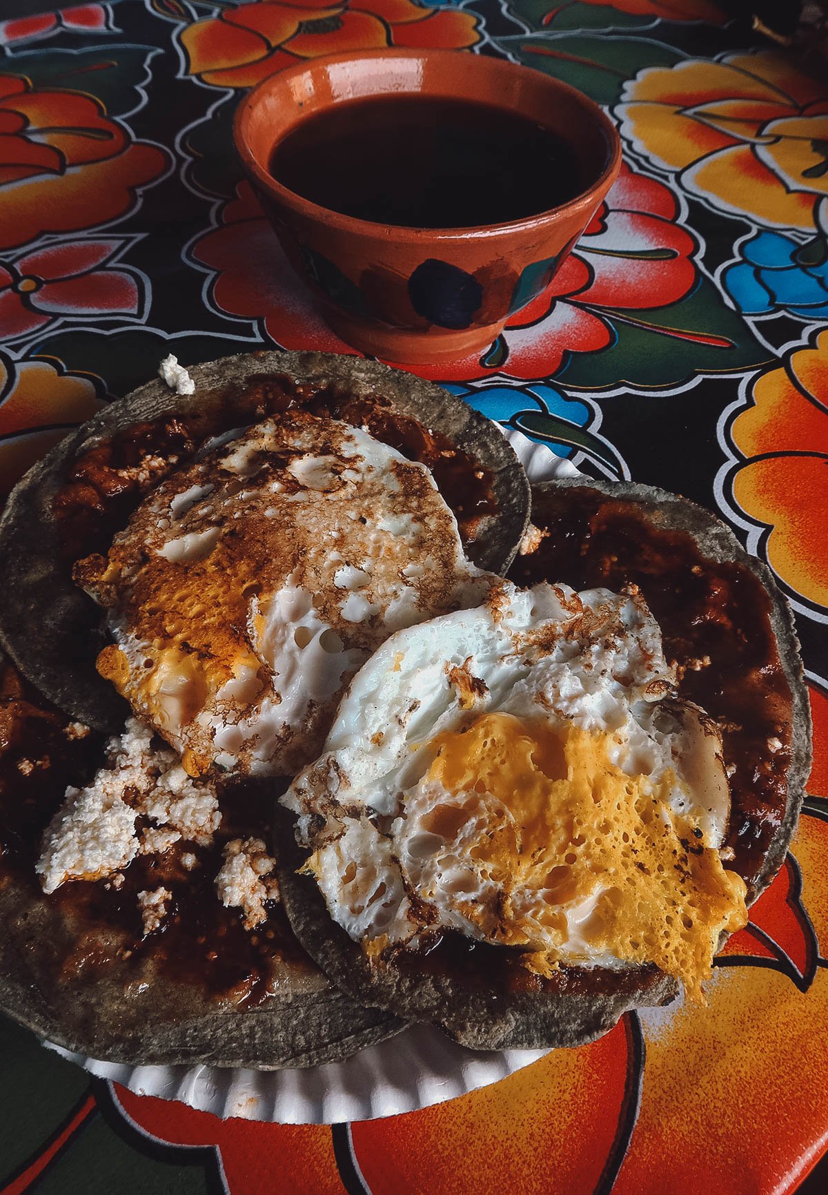 Memelas topped with fried eggs