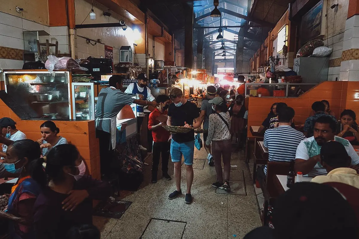 Hallway with carne asada vendors