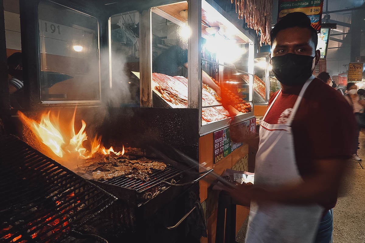 Vendor grilling meat