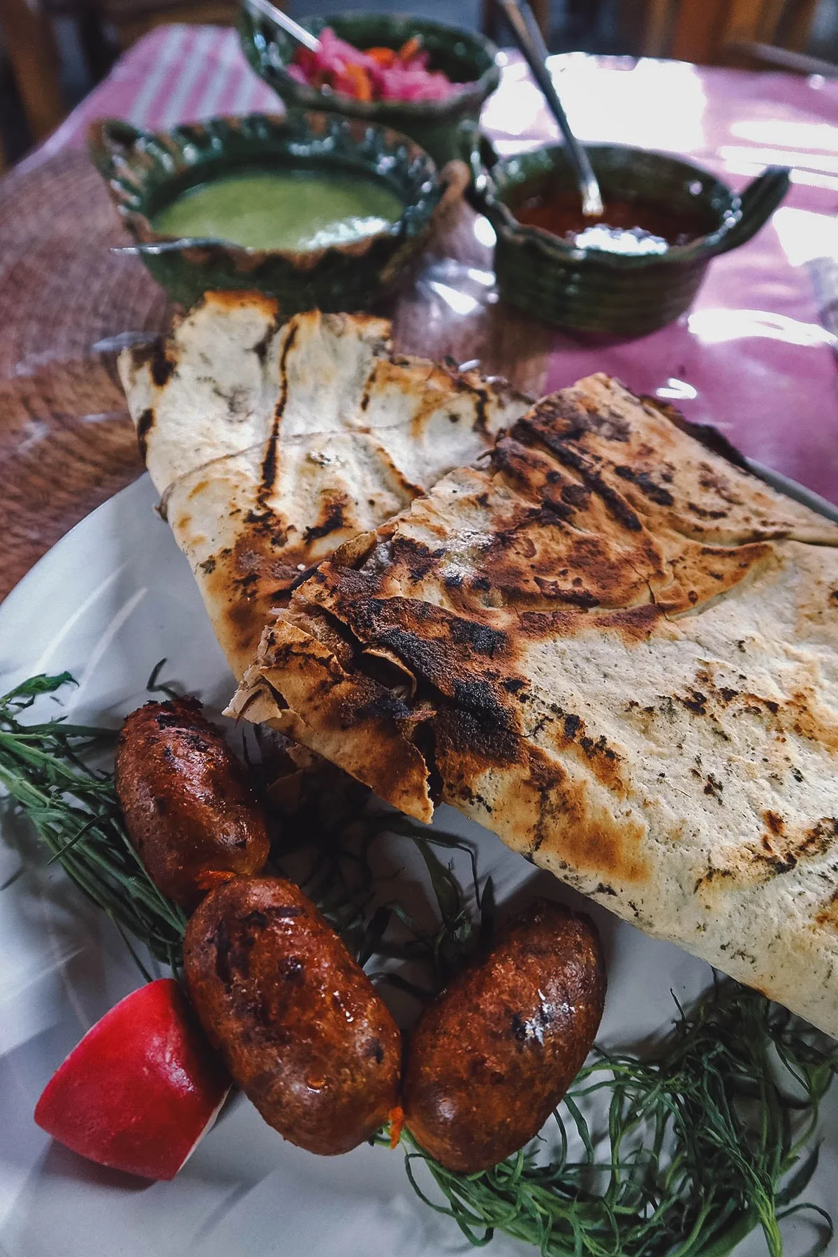 Tlayuda with chorizo and herbs