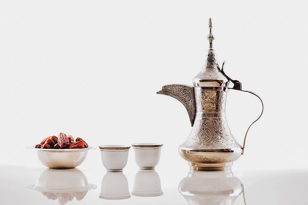 Emirati Food Dallah or coffee pot with Arabic coffee and a bowl of dates