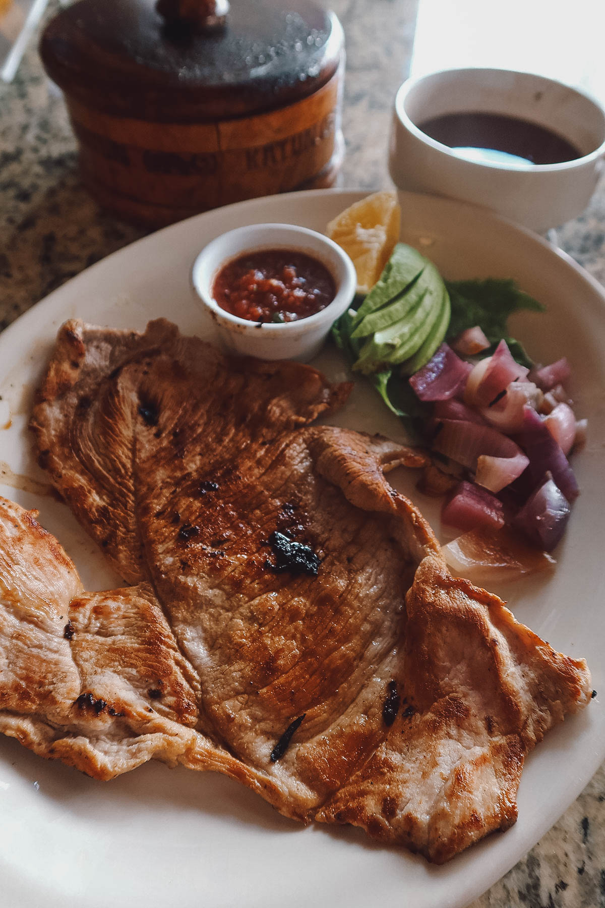 Poc chuc, thin pork filet marinated in citrus juice