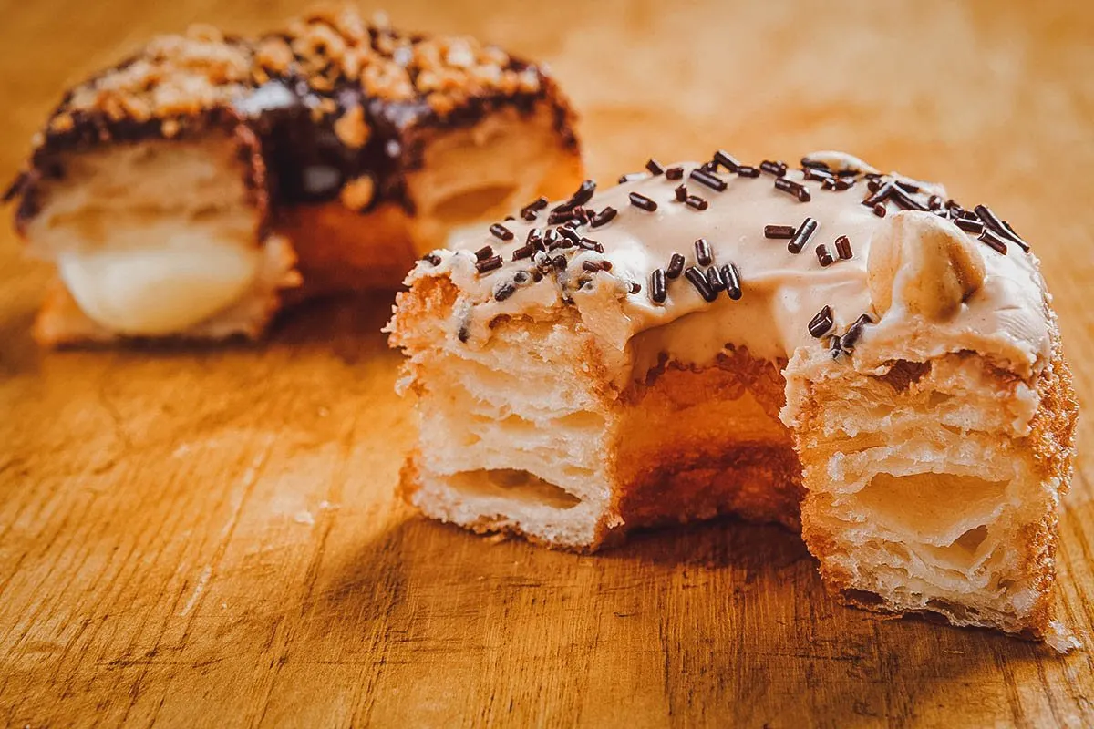 Two cronuts sliced in half