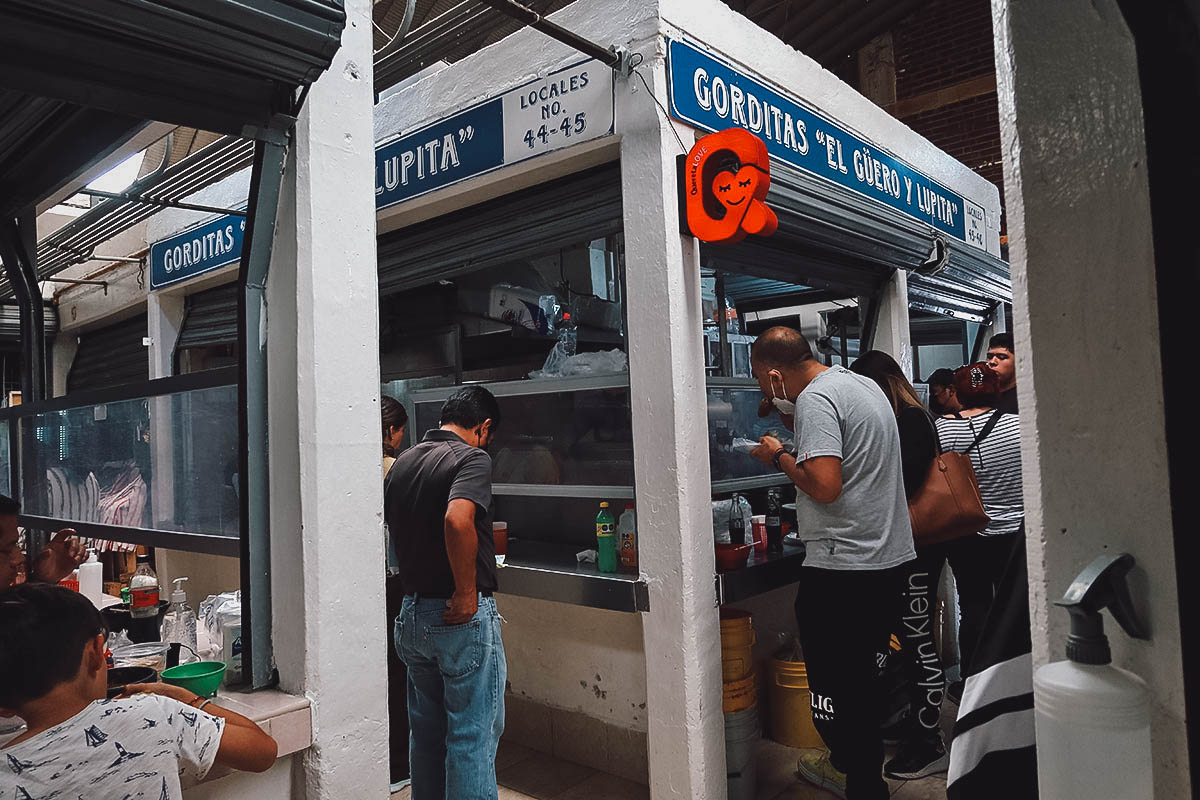 Diners at Gorditas El Guero y Lupita stall in Queretaro