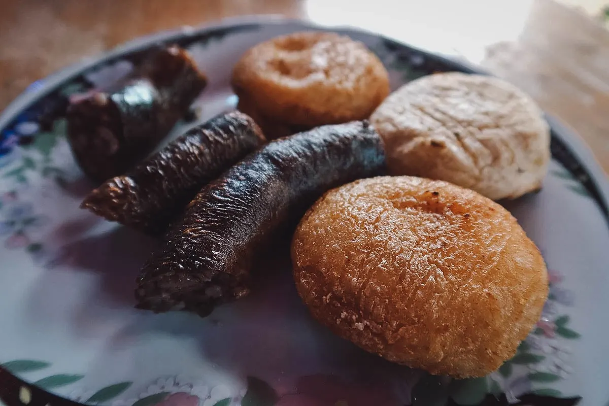 Sausages and arepas at La Gloria de Gloria restaurant in Medellin