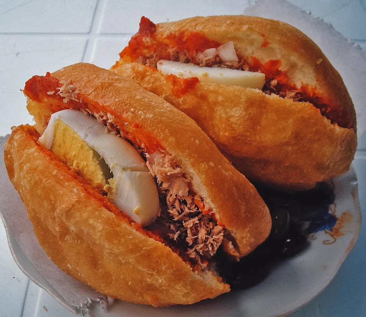 Tunisian Food Fricassee, a Tunisian fried sandwich made with tuna, hummus, and boiled egg