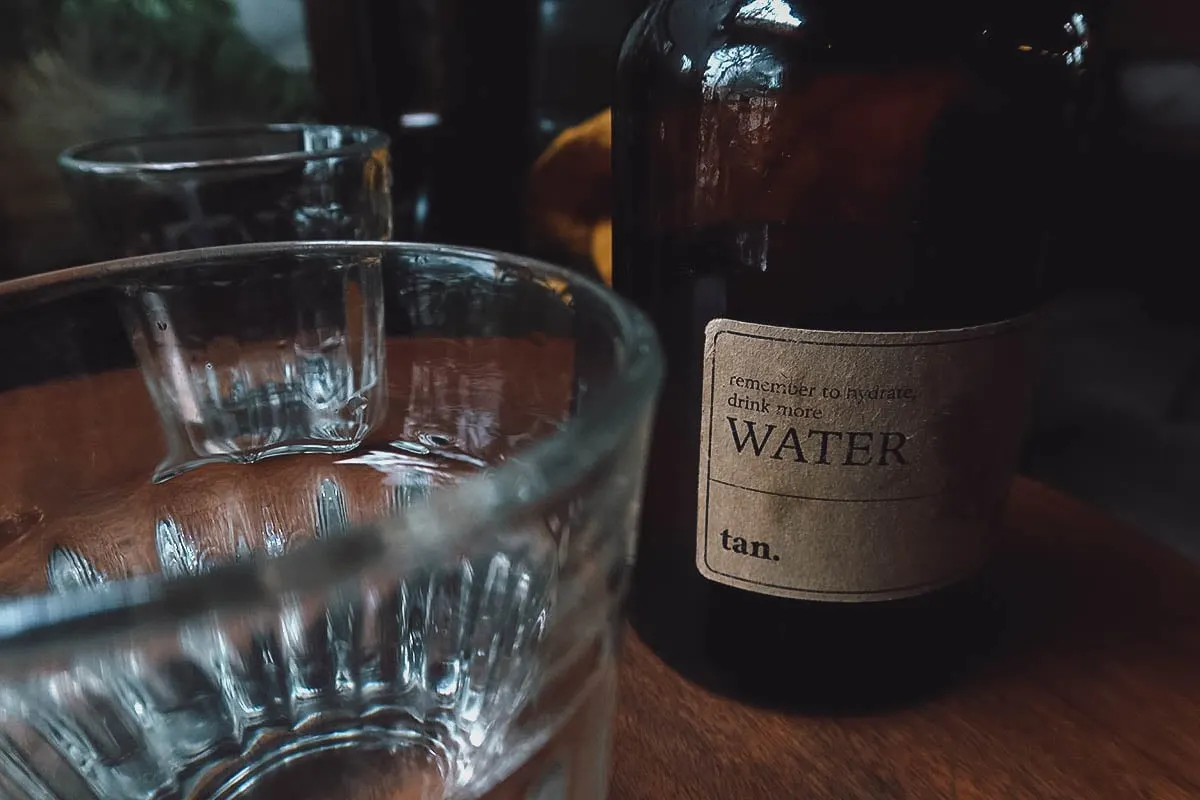 Instagrammable Cafes in Hue, Vietnam Jar of water at tan cafe in Hue, Vietnam