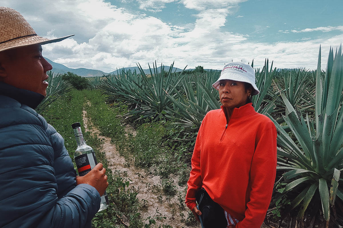 Drinking mezcal from an agave leaf at Mal de Amor Mezcaleria in Oaxaca, Mexico