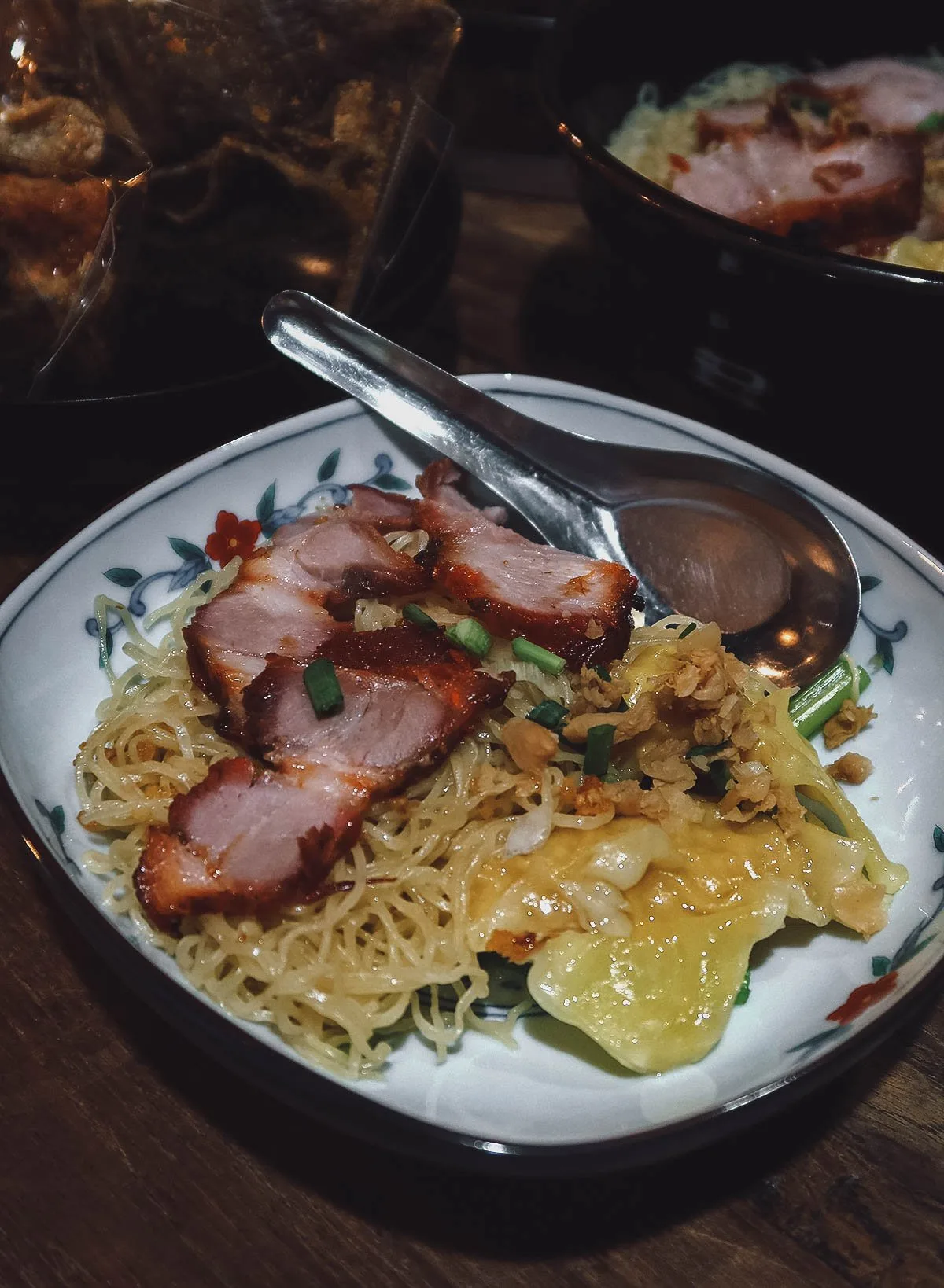 Barbecued pork over noodles in Bangkok, Thailand