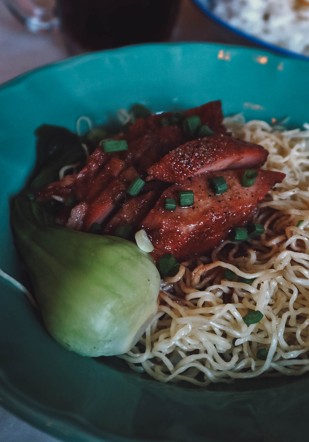 Barbecued pork over noodles in Bangkok, Thailand