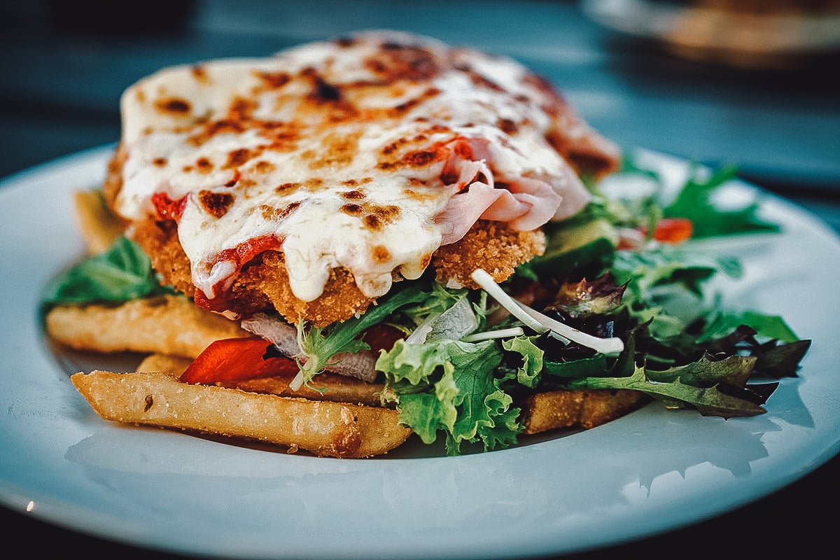 Australian chicken parma topped with melted cheese