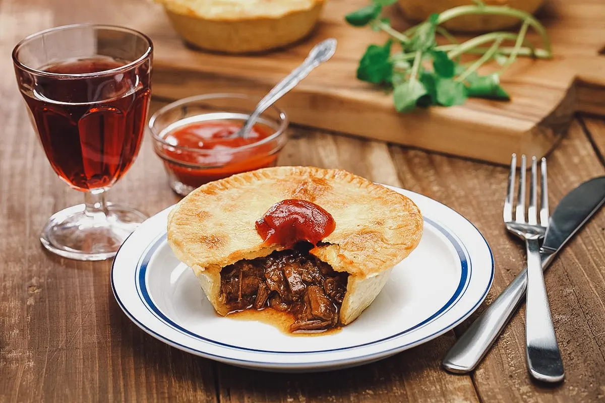 Australian Food Aussie meat pie topped with tomato sauce