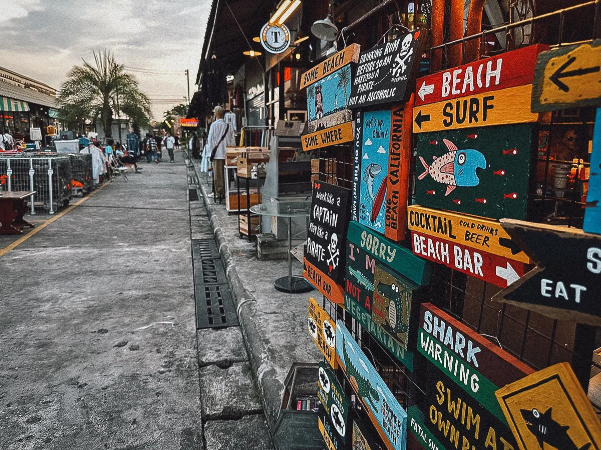 Handpainted signs for sale at Srinagarindra Train Market in Bangkok