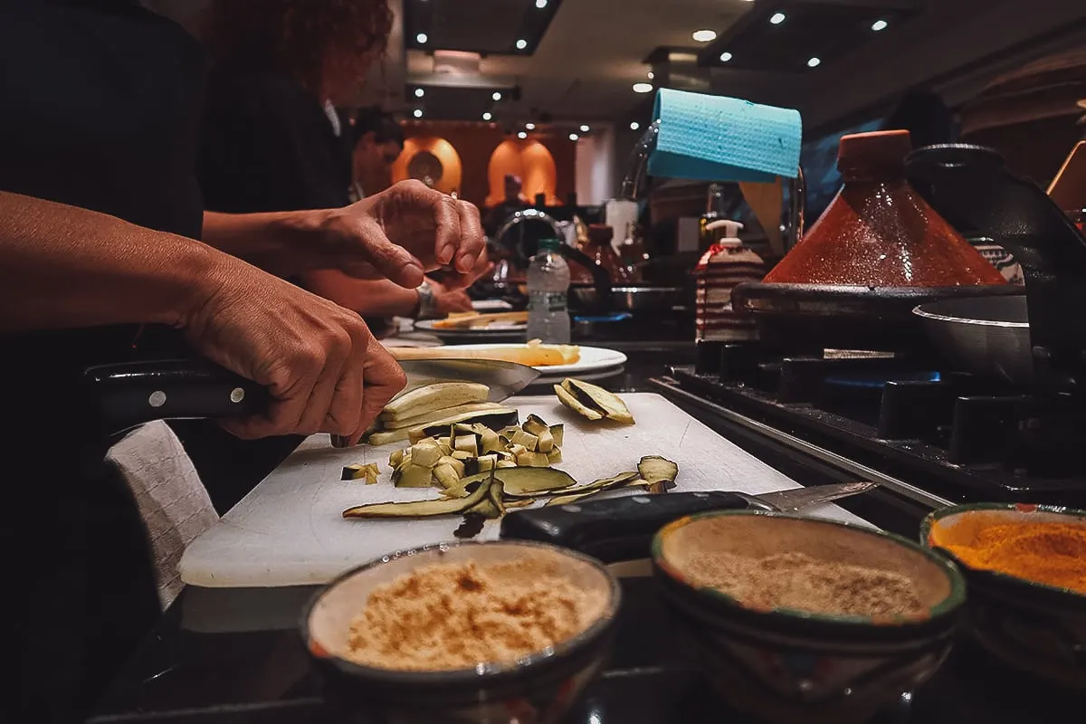 Prepping ingredients at a Marrakech cooking class in La Maison Arabe