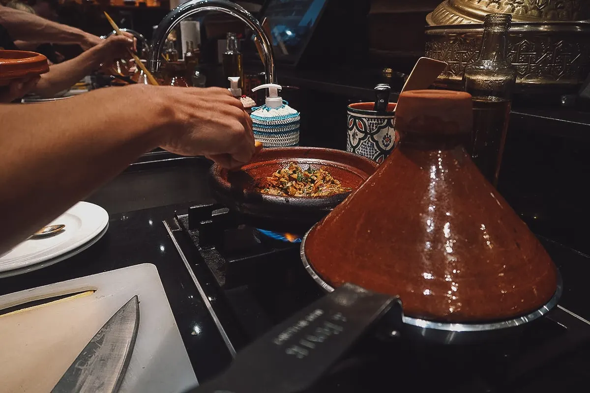 Cooking tagine at a Marrakech cooking class in La Maison Arabe