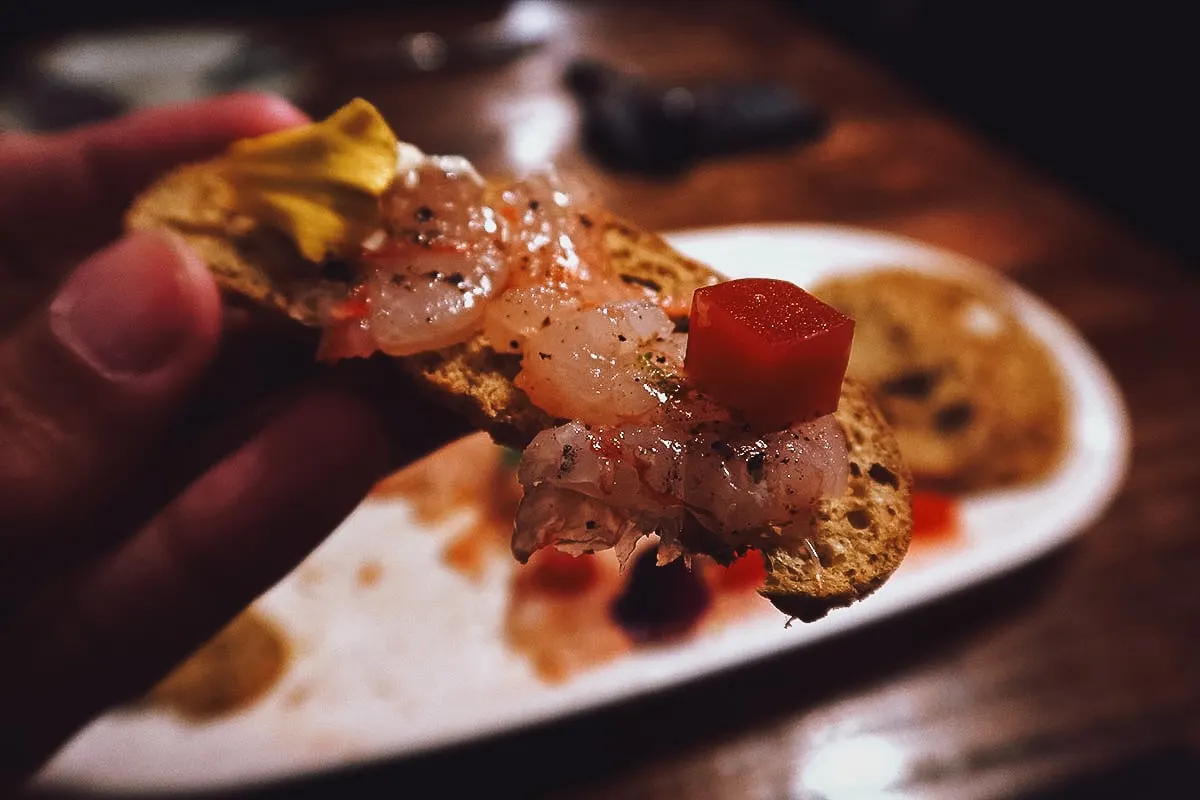 Shrimp carpaccio on toast at a restaurant in Barcelona