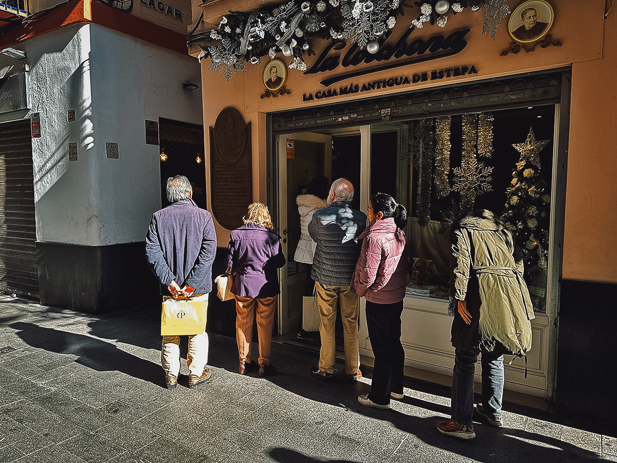 Queue outside the La Colchona shop in Seville