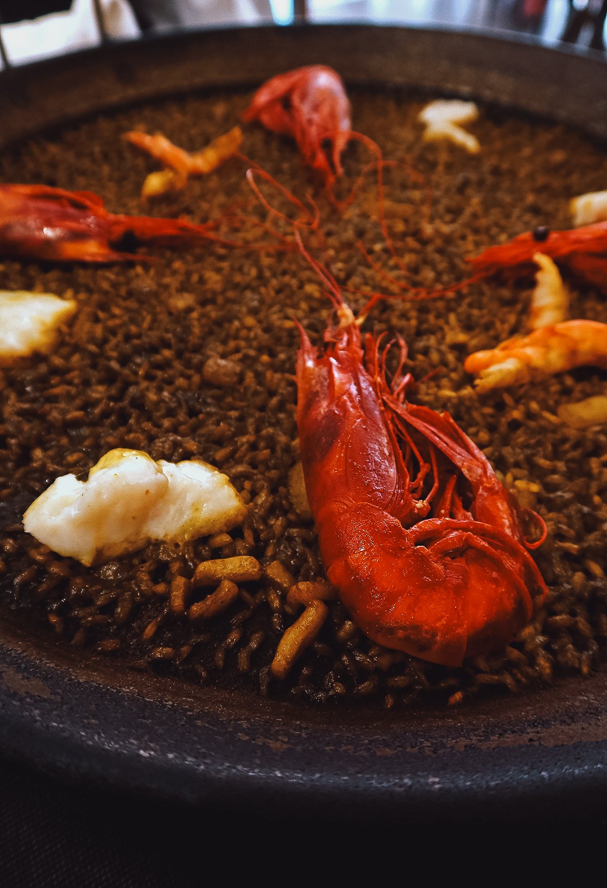 Seafood paella with scarlet prawns at a restaurant in Valencia