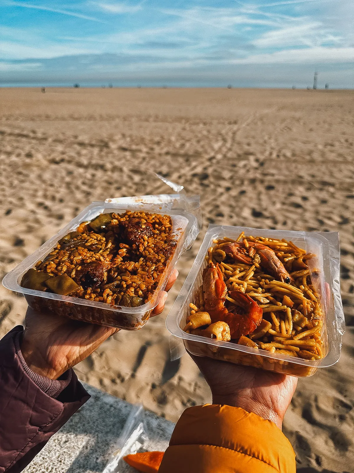 Tubs of paella at the beach in Valencia