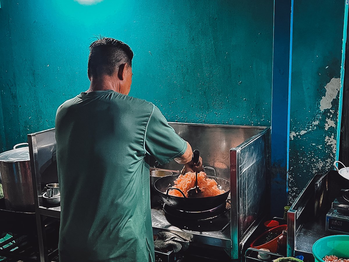 Man cooking rice