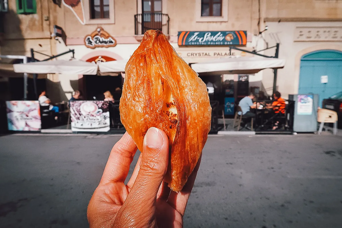Malta Restaurant Guide Holding pastizz outside Is-Serkin