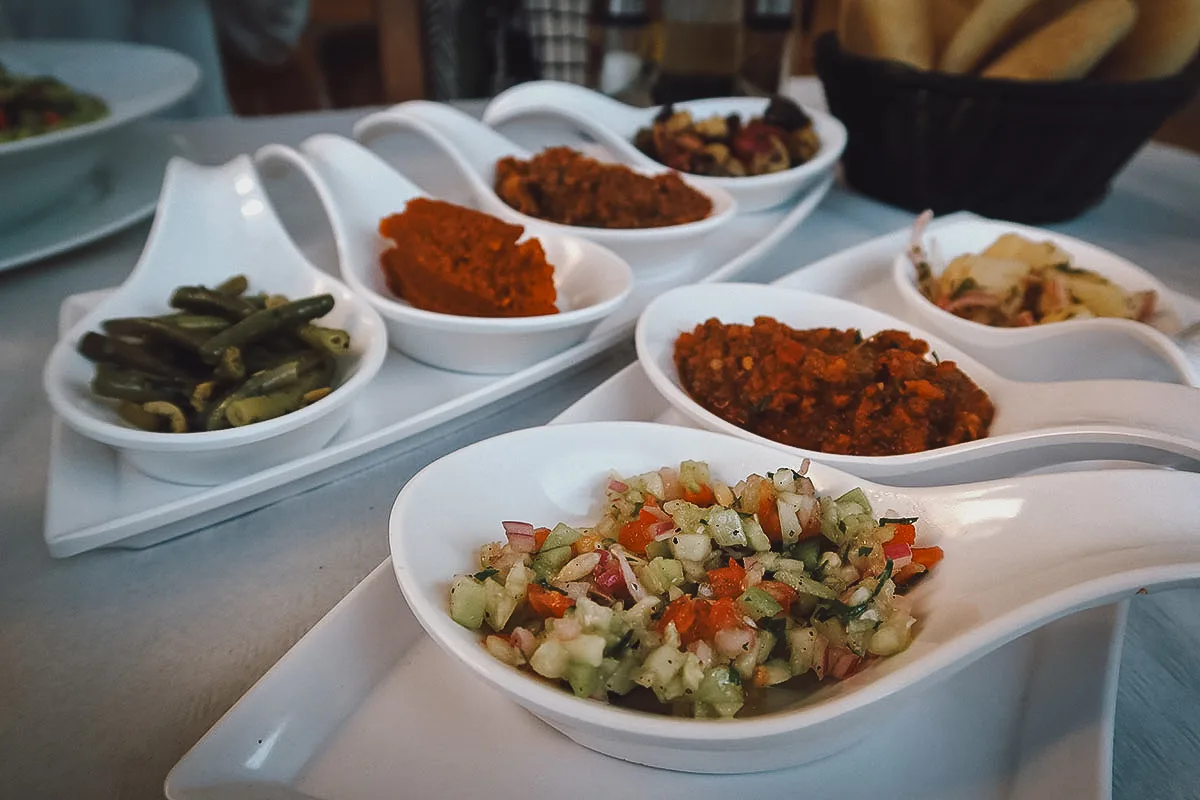 Moroccan appetizers on spoons at a restaurant in Tangier
