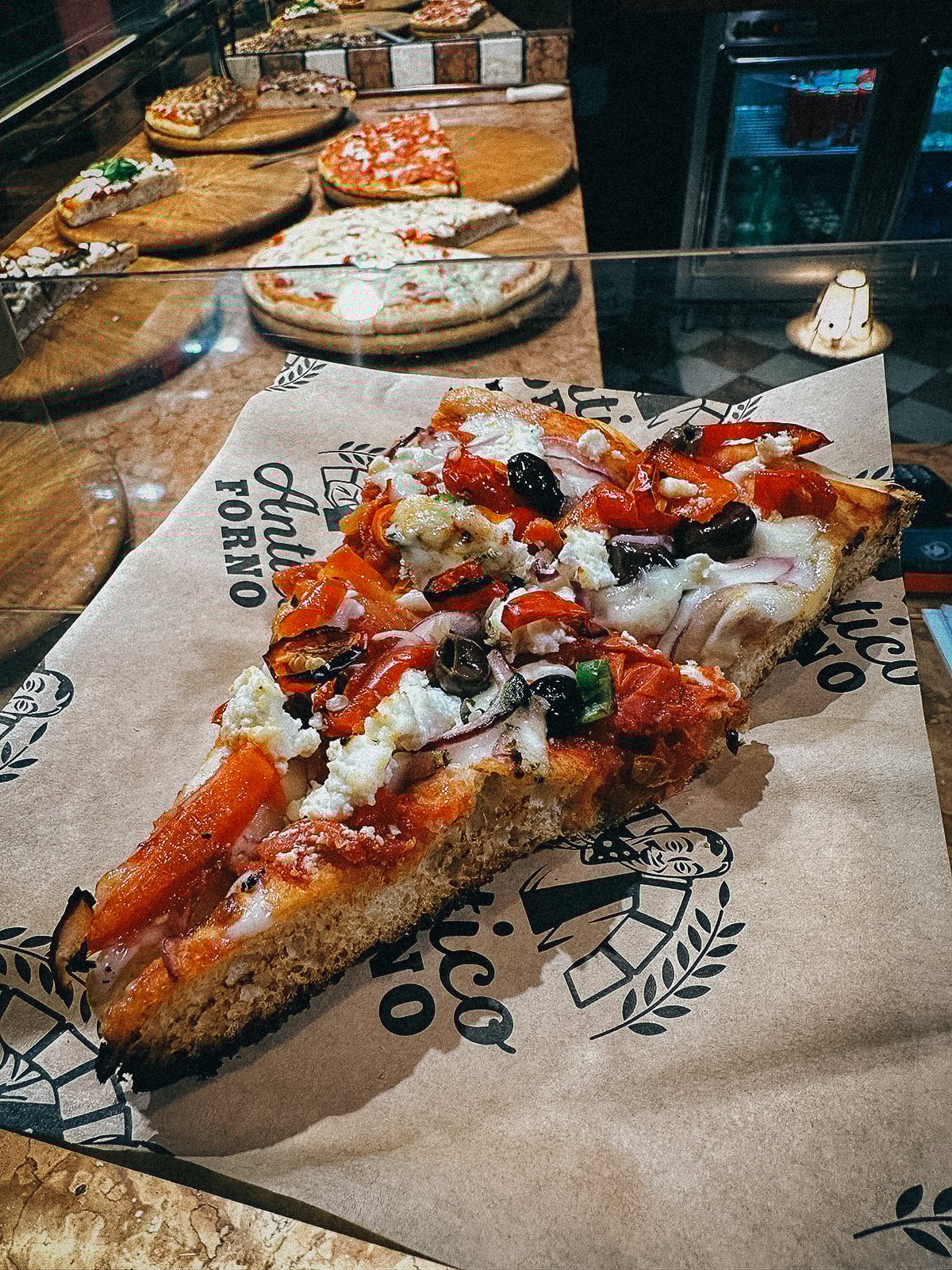 Slice of thick-crust pizza