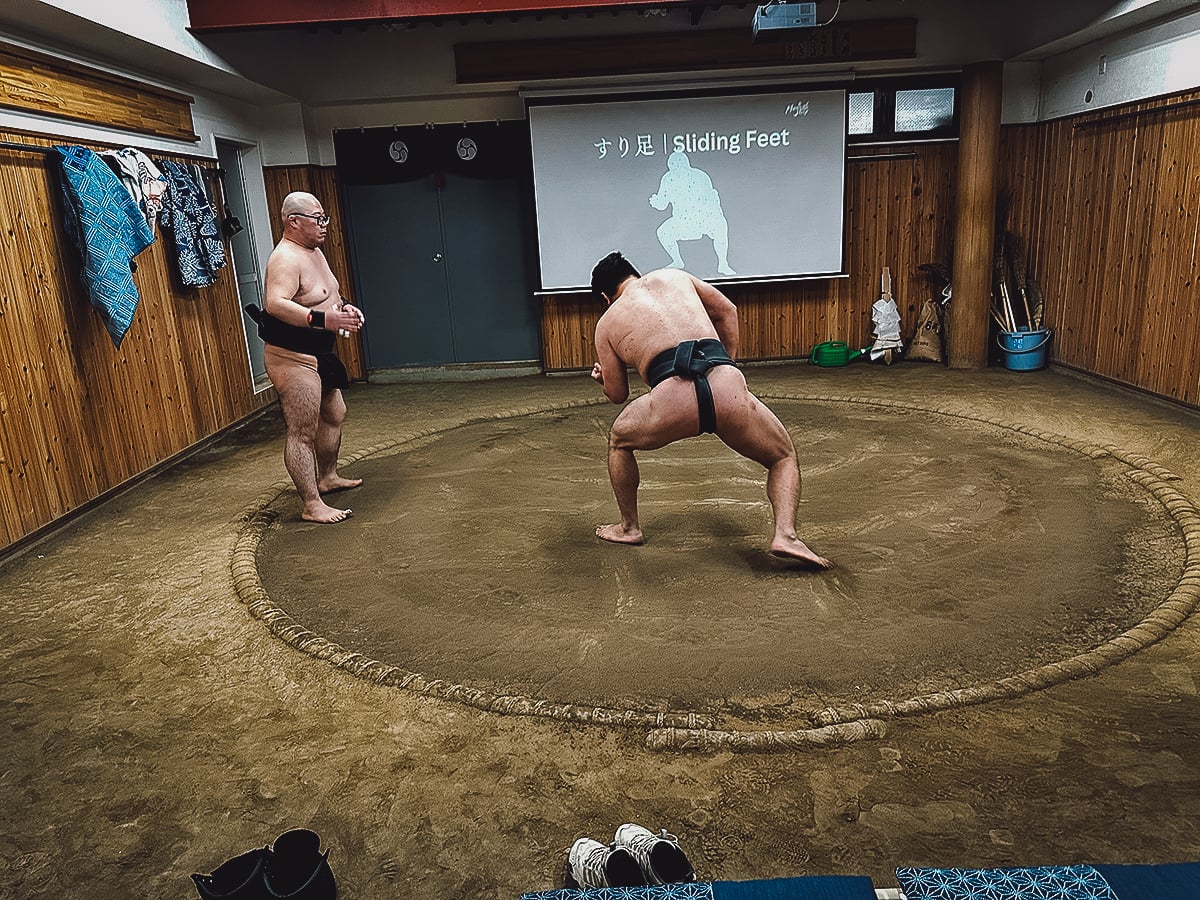 Sumo Experience in Tokyo Retired Sumo wrestlers demonstrating different moves