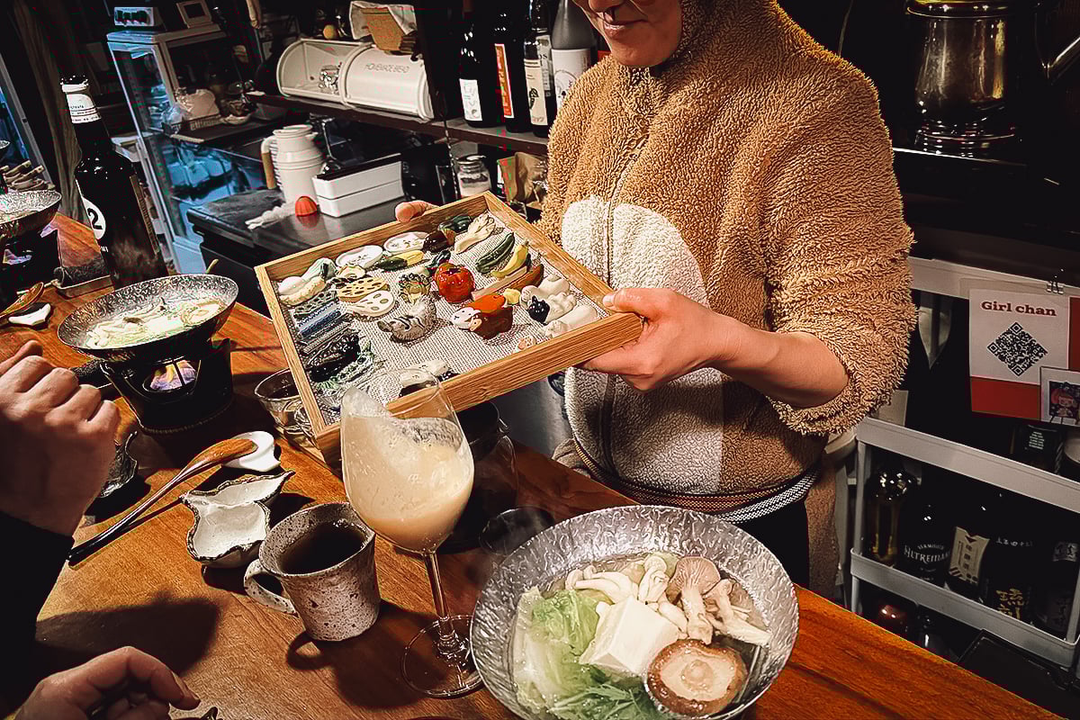Veganic Monkey Magic Chef Monkey-san with a tray of chopstick rests