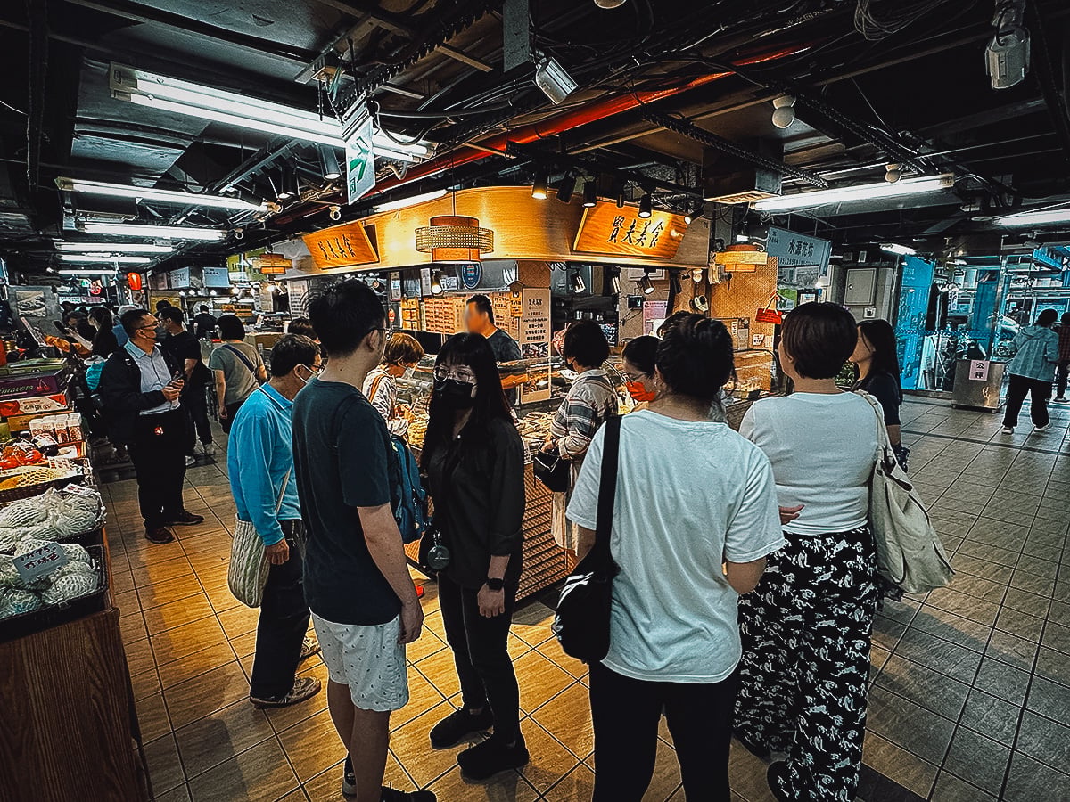 The Best Restaurants in Taipei Customers at a stall in Taipei