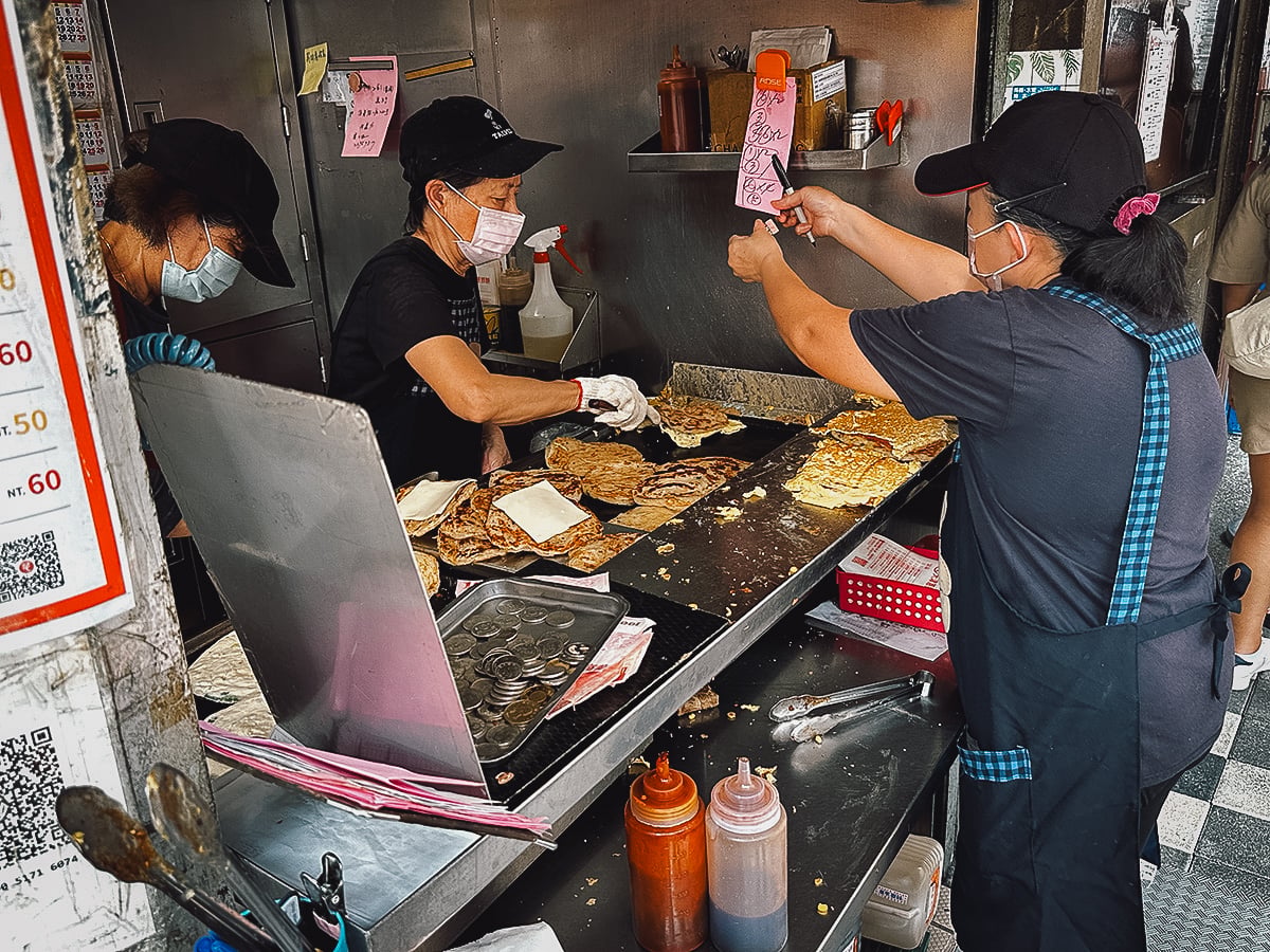 The Best Restaurants in Taipei Workers making onion pancakes at a restaurant in Taipei